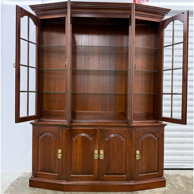 Timeless solid cherry China cabinet by Pennsylvania House. Features high end construction with bubble glass doors,...