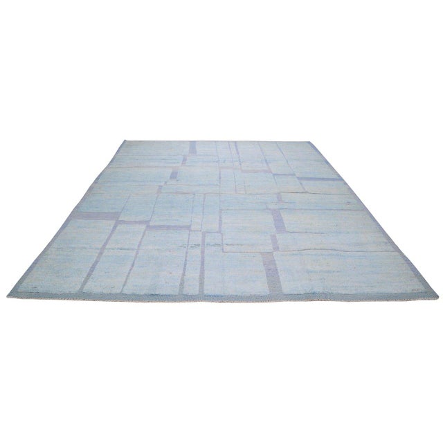 Hand-knotted with care using traditional rug-making techniques, this wool rug blends timeless craftsmanship with a modern...