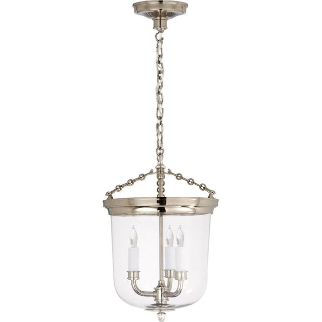 Merchant Lantern in Polished Nickel with Clear Glass Designer: Thomas O'Brien Canopy: 5.25" Round Mounting: Chain Shade...