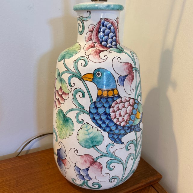 Fabulous vintage rare large ceramic hand-painted table lamp by Romano Innocenti featuring bold colors, a bird and flowers....