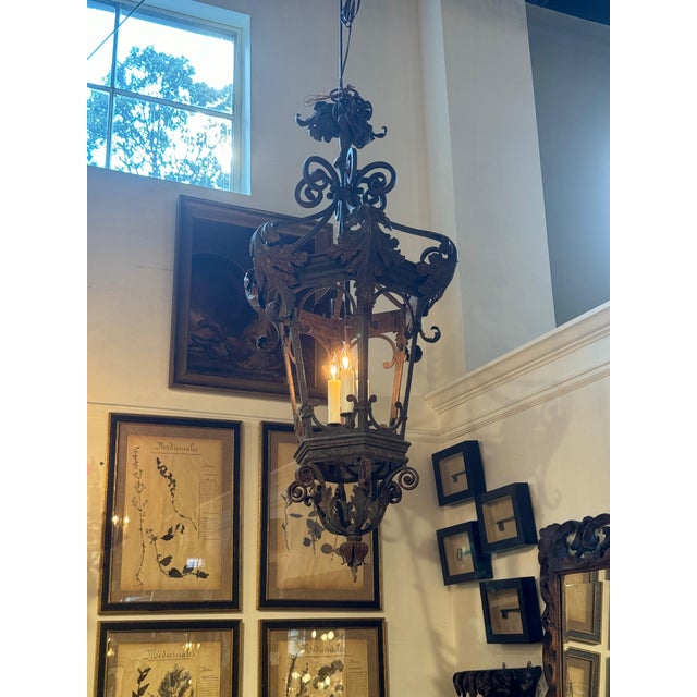 Italian lantern from Piedmont c. 1900. Newly rewired with hanging 3 light fixture. 20”dia x 46”h 45-275