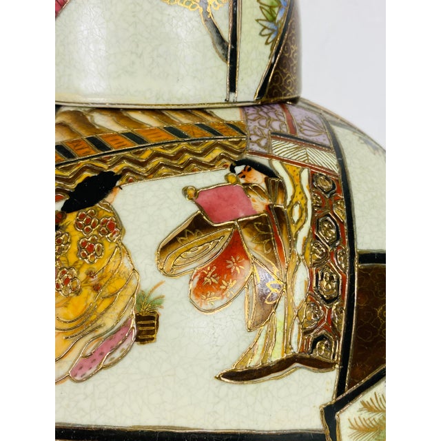 This is a vintage mid century handpainted Satsuma ginger jar with lid. This Japanese export jar with lid has Figurative...