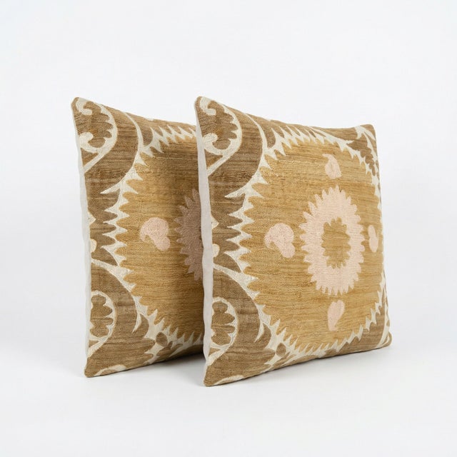 This beautiful 24'' x 25'' hand-embroidered Suzani pillow cover set was made from authentic Uzbek cotton fabric. The...