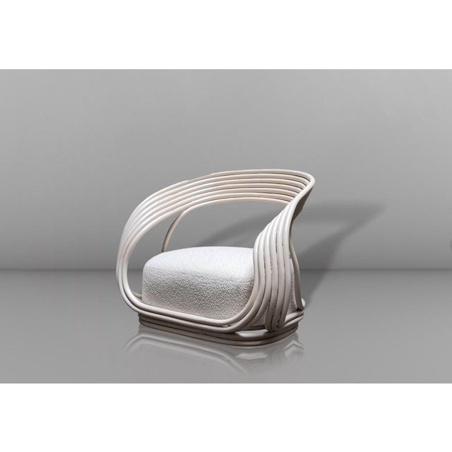 Eva armchair, designed by Giovanni Travasa in 1965. The structure is made of hand-bent rattan (often also called Manao or...