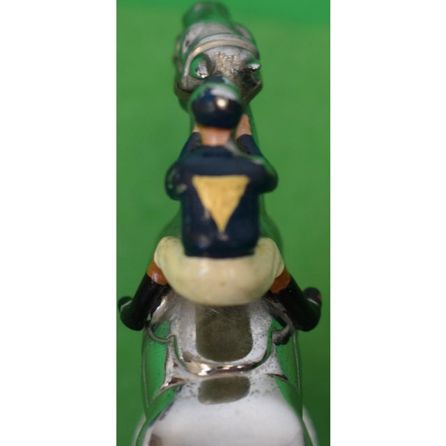 Sz: 3 1/4"H x 4 3/4"L x 1"D w/ hand painted owner's racing colours w/ bonnet mount bracket/ bolt & screws