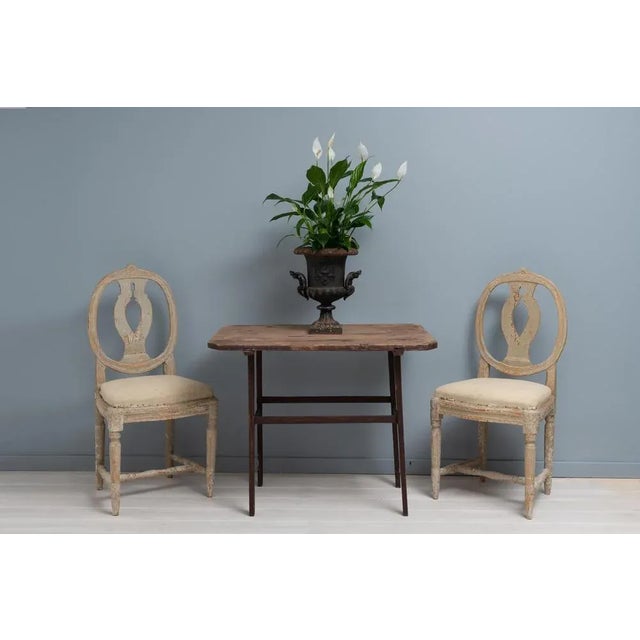 Rare folk art table from Sweden, dated underneath to 1819. The table is pine and has the warm patina of aged wood. Marked...