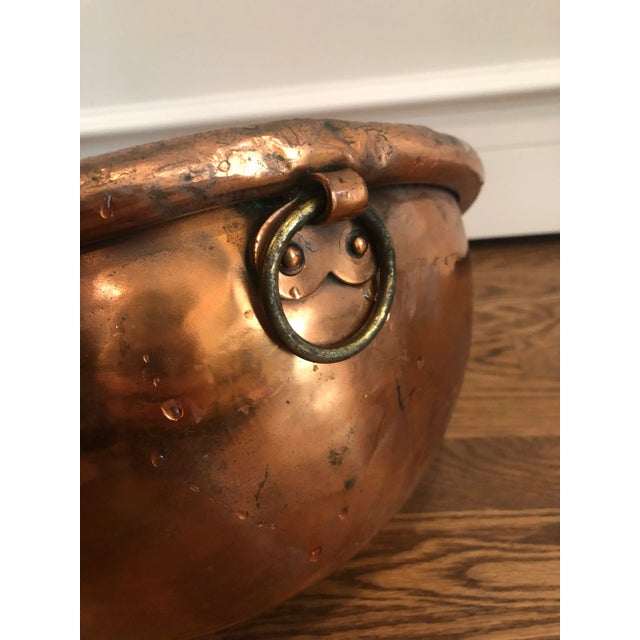 Stunning shiny copper French confectioners bowl with brass handle.