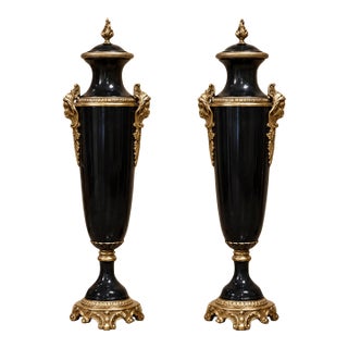 Set of 2 French Empire Style Black Decorative Urns With Gilded Bronze Foliate Mounts and Ornate Bases For Sale