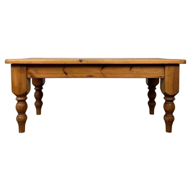 A charming and characterful 20th-century pine farmhouse coffee table, combining traditional country styling, generous...
