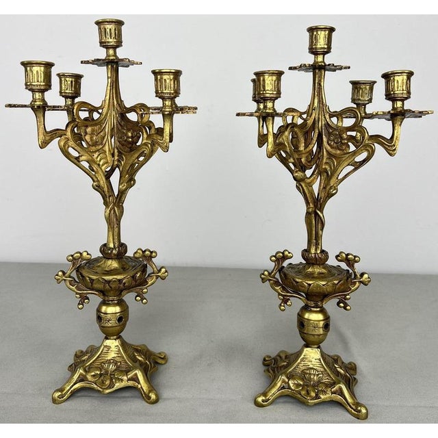 An ornate Vintage French pair of candelabras , beautifully presented with elaborate scrolling forms, floral decoration,...