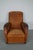 This leather club chair comes from France and was made circa 1950s. It is upholstered with cognac-colored leather and...