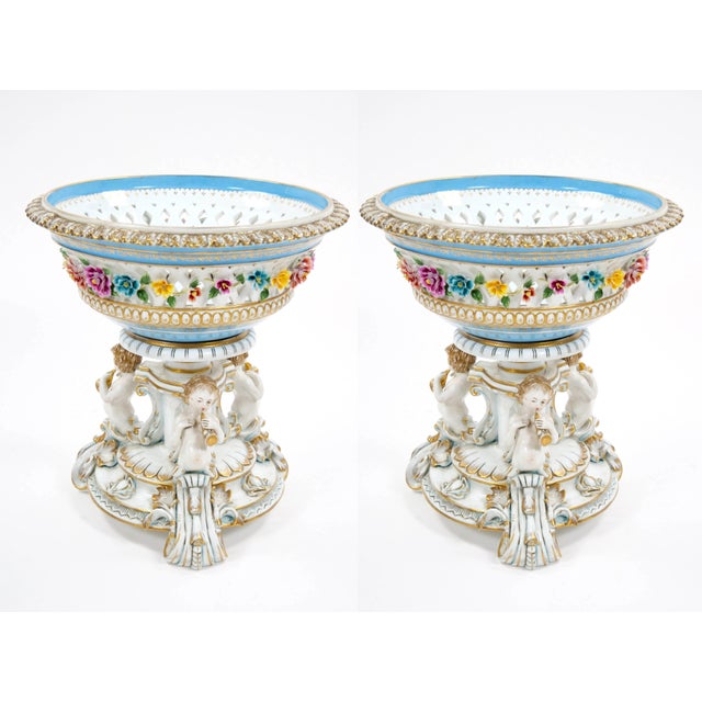This exquisite pair of very large German porcelain figural centerpieces exemplifies the refined artistry and craftsmanship...