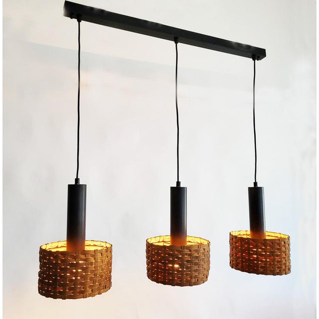 Lovely Scandinavian 3-part pendant light in very good vintage condition with light patina to the lacquered steel base....