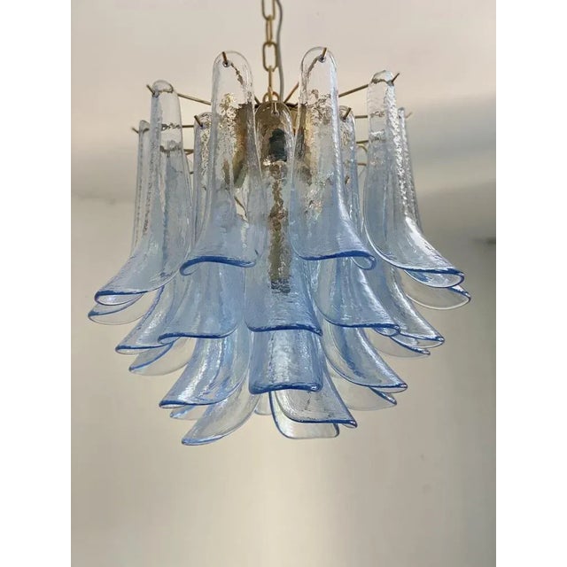 Contemporary blue “selle” murano glass chandelier blue transparent “selle” elements in murano glass, glass elements poured...