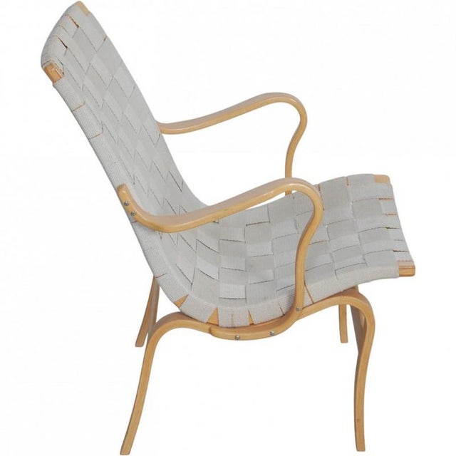 Bruno Mathsson Eva chair with an upholstery of canvas fabric and a frame of lacquered beech. The chair is from the 1990s...