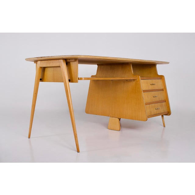A modernist desk, balanced and clearly designed with functionality in mind. Produced around 1955. its tablet-like shape...