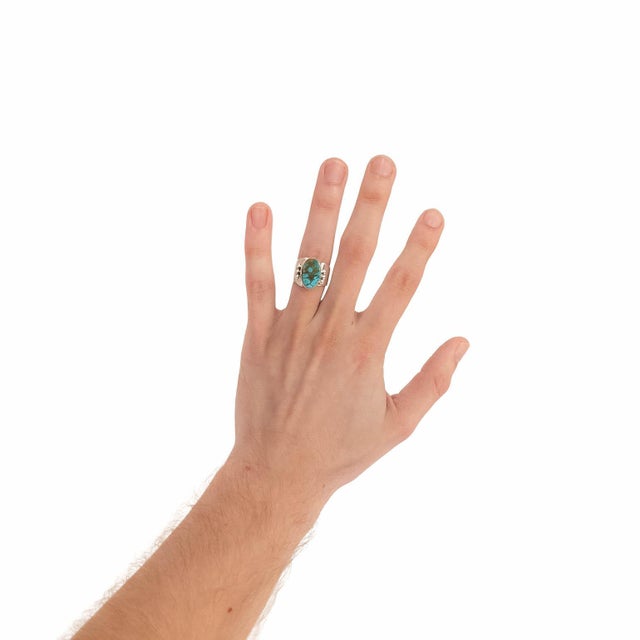 A fine vintage Native American silver and turquoise ring. By Delvin John of the Navajo tribe. In sterling silver. With a...