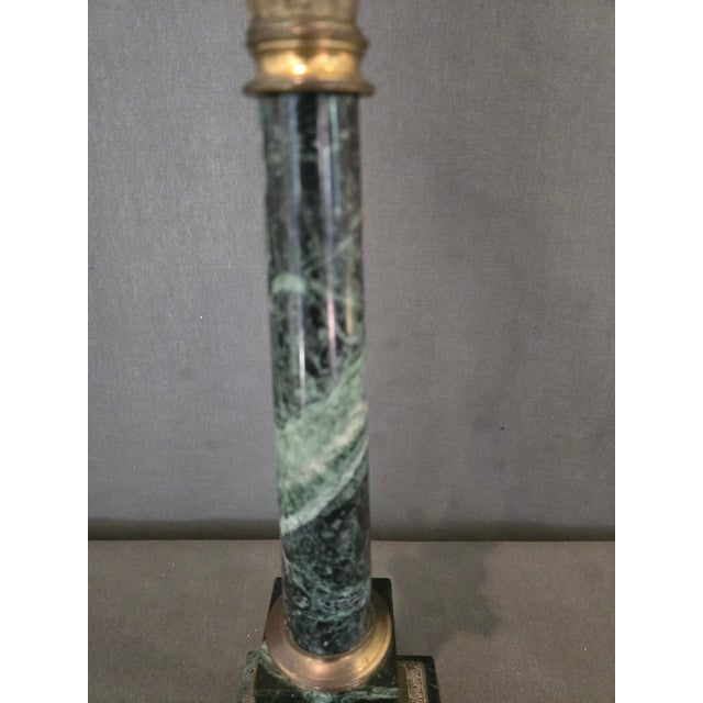 Neoclassic column lamp made of dark green marble with bronze accents. The lamp has new wiring with a 3way light socket.