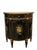 Elegant Theodore Alexander Louis XVI-style demilune cabinet featuring a dramatic black finish, rich gilt detailing, and...
