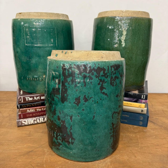 "About This Piece About This Piece This trio of tall green glazed ceramic jars bridges utility and artistry with...
