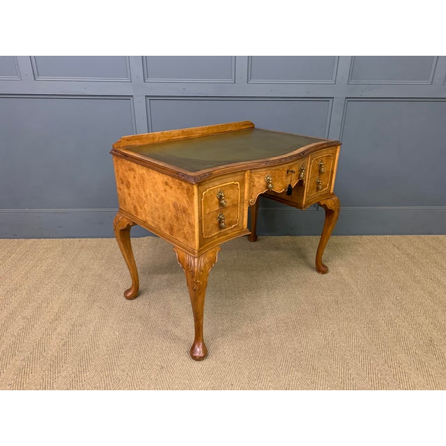 A good early 20th century burr walnut writing desk in the Queen Anne style. Well constructed in solid walnut with...