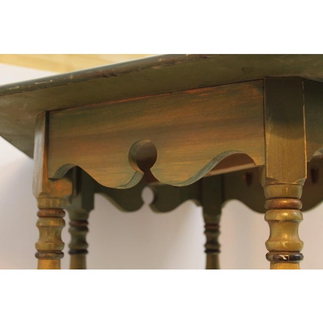 Solid mahogany and walnut wood with a hexagon top, recessed scroll carving, turned legs. Beautiful grain. Legs and center...