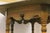 Mahogany and Walnut. recessed scroll carving in the mahogany wood top. Beautiful grain. Legs and center finial are walnut...