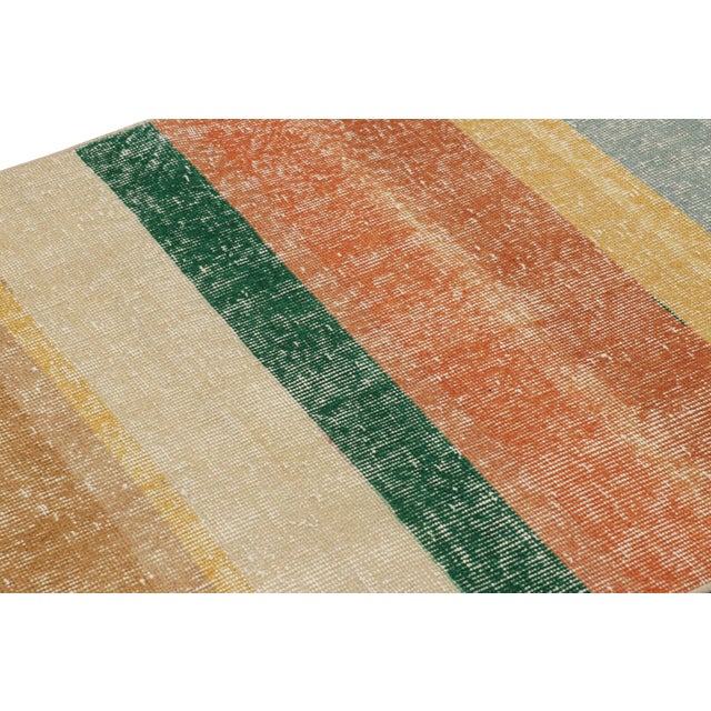 Hand-knotted in wool and originating from Turkey circa 1960 – 1970, this 3x6 vintage Zeki Müren runner is a unique...