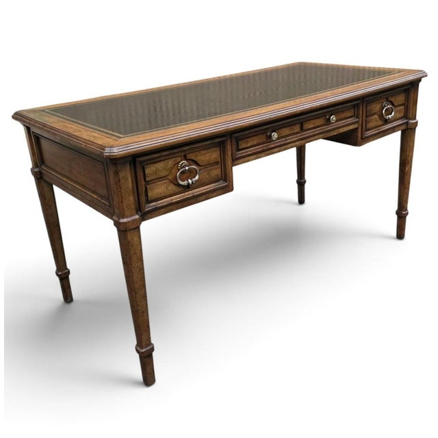 Sligh Furniture Regency Revival executive writing desk, dating to the mid-20th century, crafted in richly figured walnut...