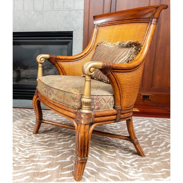 The Ethan Allen Bermuda Chair features a tightly woven backrest, curled metal armrests, and a rattan-style four-legged...