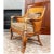 The Ethan Allen Bermuda Chair features a tightly woven backrest, curled metal armrests, and a rattan-style four-legged...