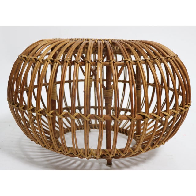 Nice vintage rattan ottoman in original natural finish. This example is in very good estate condition free of breaks or...