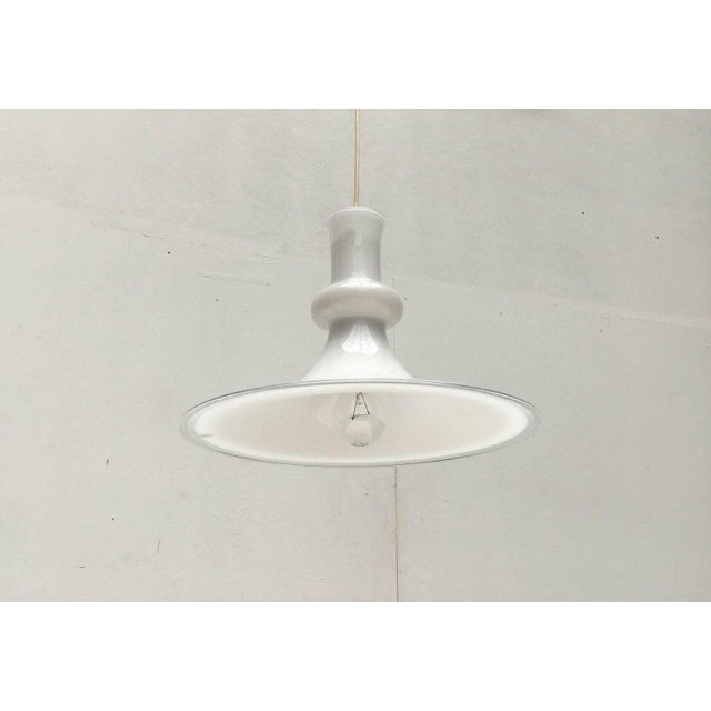 Danish glass pendant lamp by the renowned manufacturer Holmegaard / Royal Copenhagen, designed by Michael Bang in the...