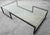 This is an extremely large and versatile metal and glass coffee table. The table frame is a unique shape and very minimal...