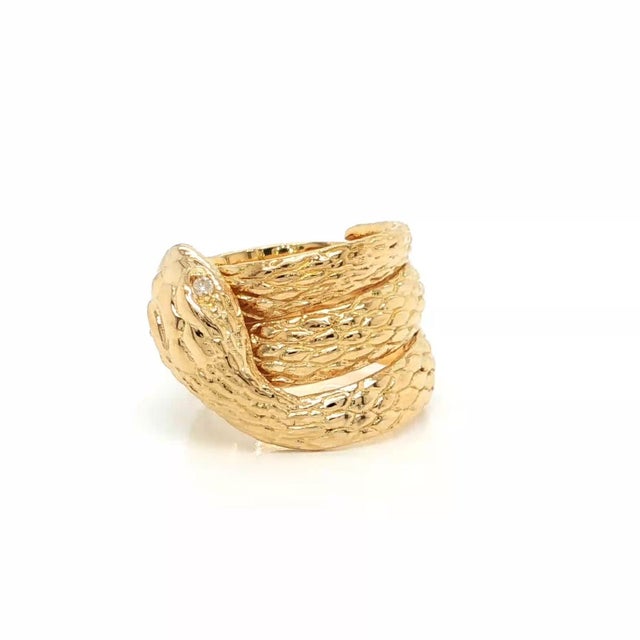 This authentic estate snake ring is crafted in solid 18k yellow gold with a polished finish and features a beautifully...