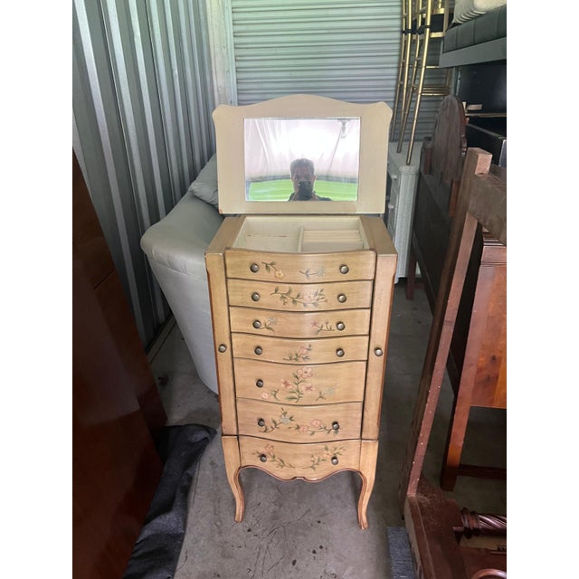 This hand-painted vintage jewelry cabinet is designed in a French Country/ Cottage Chic style. It has romantic floral...