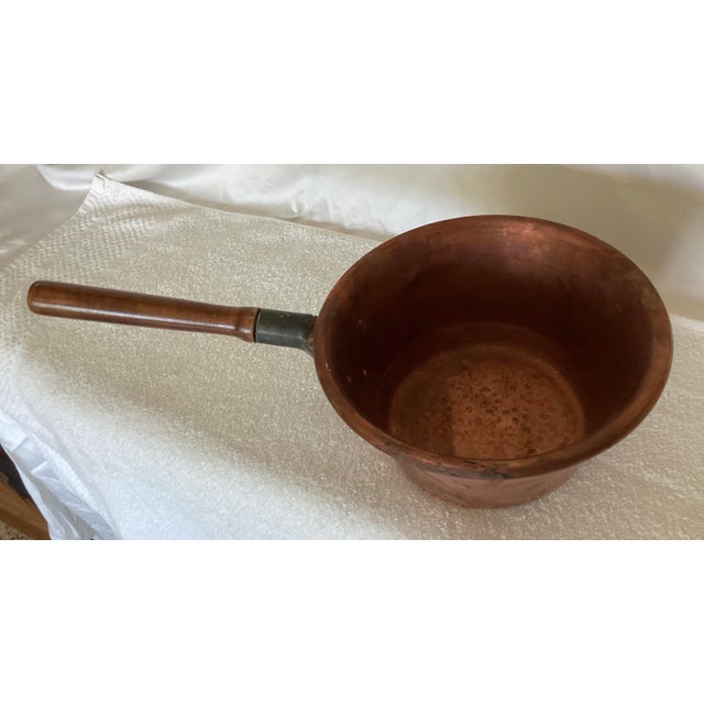 Handmade Italian copper polenta pot with wooden riveted handle. Hammered detail on inside and outside. Gorgeous patina....