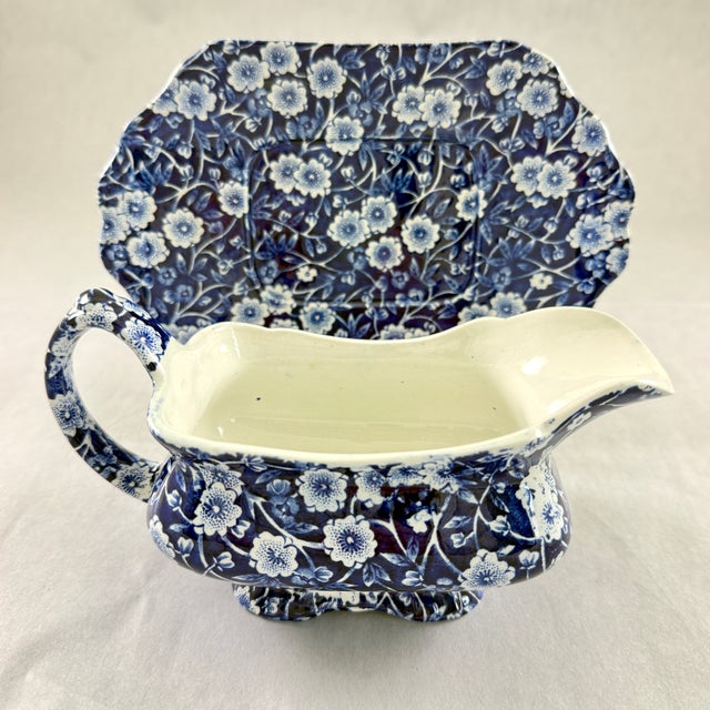 A Blue Calico transfer printed gravy boat and underplate, Staffordshire, England, circa 1940 – 1960s. Crownford China Co....