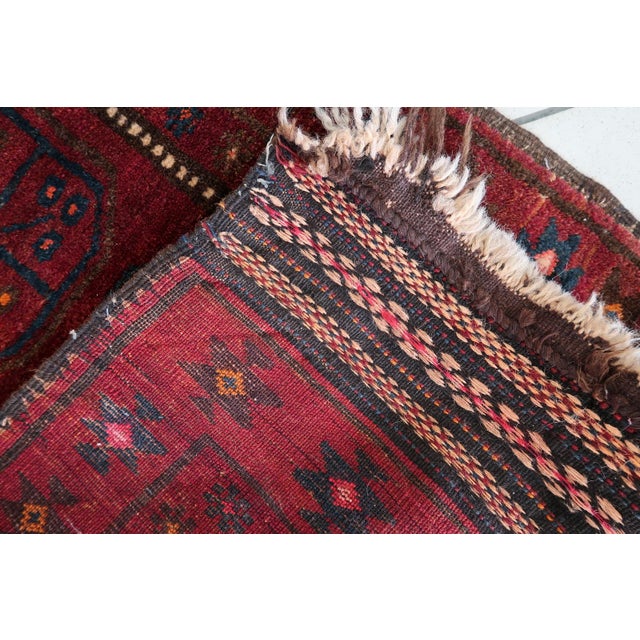 Handmade Vintage Afghan Baluch Rug – 2' x 3.5' – 1950s Wool Tribal Accent Rug Enhance your space with this handmade...