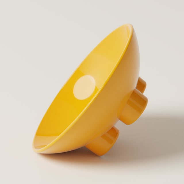 A sculptural ceramic bowl with a super glossy finish, ideal for fruit, dried flowers, or as a standalone art object. Part...