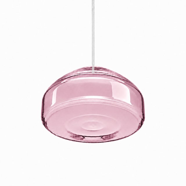 Crafted with high visual clarity, this modern pendant lamp features a sleek silhouette hand-blown from premium glass in a...
