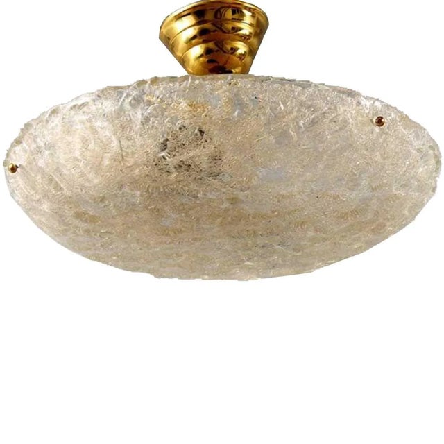 DETAILS A vintage ceiling light or plafonnier with a brass canopy, chain and tubular stem supporting a heavily textured...