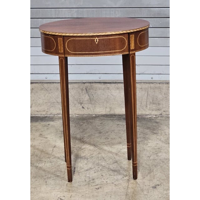 Store Item: Baker Colonial Williamsburg Federal Style Mahogany Oval Inlaid Side Table Rare Description: Table features a...