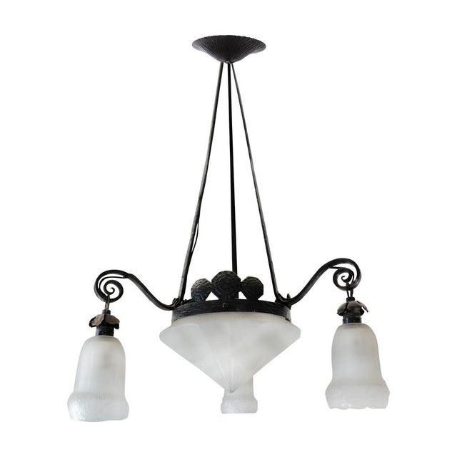 This early 20th century pendant lamp features a solid hand-forged iron frame in the Provençal style, paired with frosted...