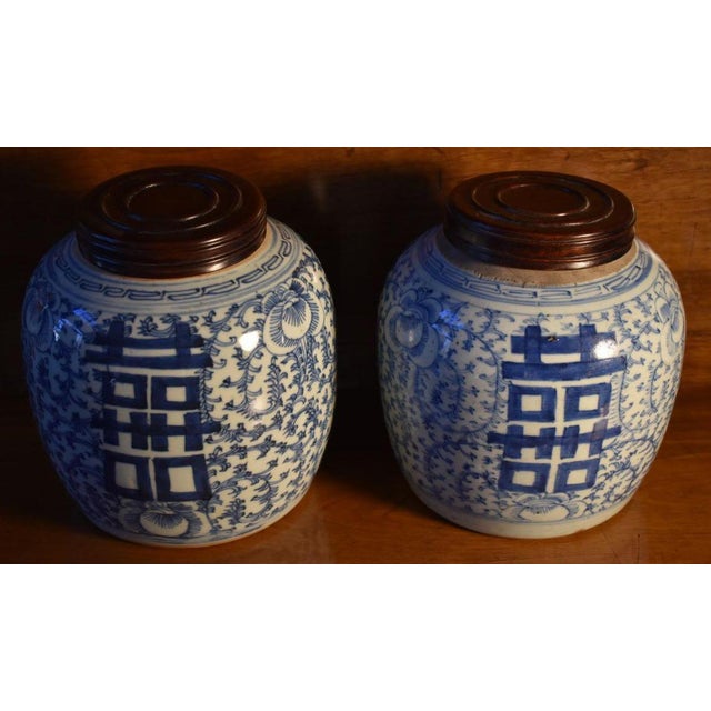 Companion pair of ginger jars. Chinese export porcelain of the 19th century with later turned wood lids. Decorated with...