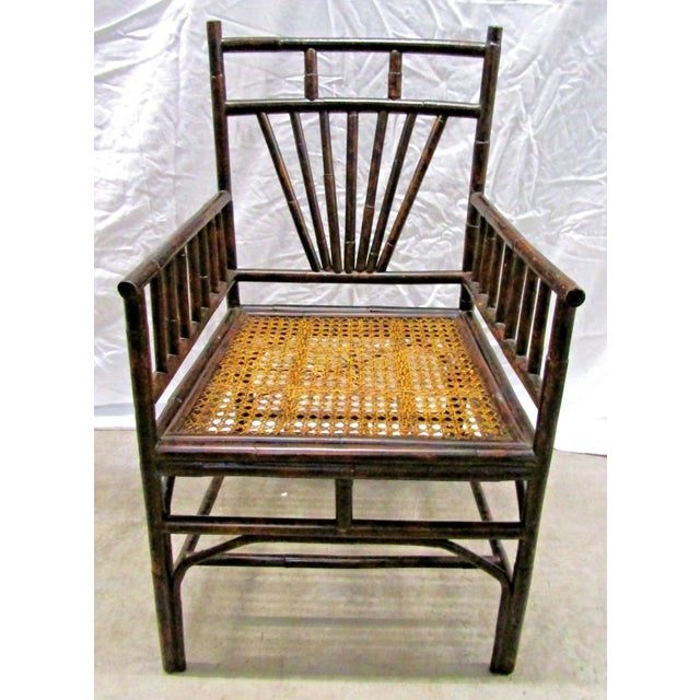 This set of four vintage burnt bamboo cane seat dining chairs is a unique and stylish addition to any room. Fully...