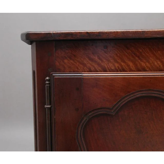 Early 19th Century French cherrywood dresser base, the rustic moulded edge top above two hinged doors with original...