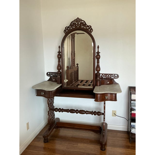 Exceptional antique Anglo-Indian carved hardwood vanity/dressing table featuring ornate fretwork panels, turned supports,...