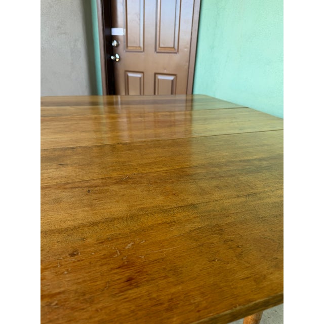 Sweet colonial table with turned legs and original wood casters. All the old colonial hooks and metal and fixtures work so...