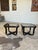 Vintage ebonized side tables with brass accents, featuring a chunky, tubular design and smoked glass tops. In excellent...